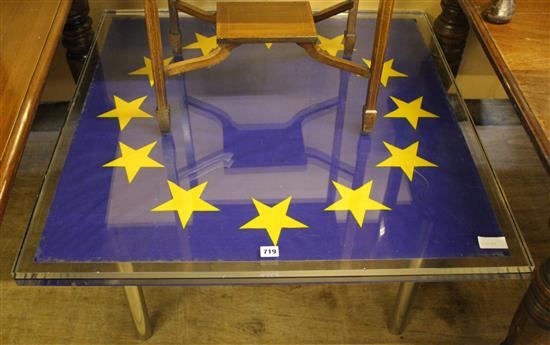 Lucite table with E.U. flag, solid chrome legs